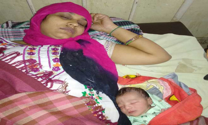 Sharmila and her newborn at the Meham General Hospital.